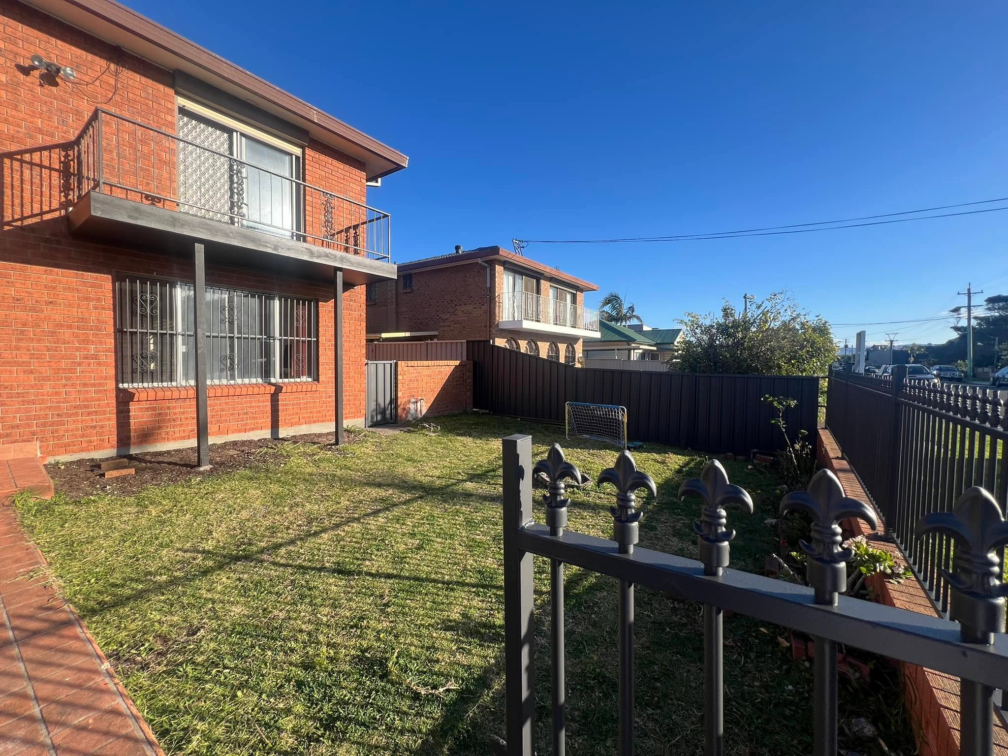A freshly maintained brick home exterior in the Shellharbour area, representing Pro-Tex Painting & Decorating's residential work